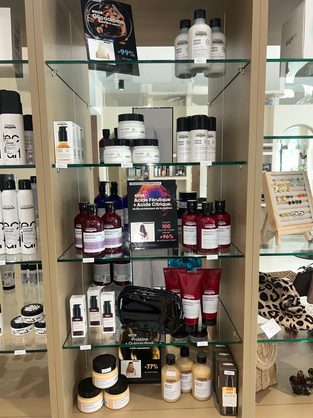 Shelves of L'Oréal shampoos and treatments at the salon